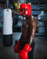 variant:red::TITLE Boxing Ko-Vert Training Boxing Gloves on boxer in the gym