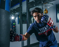 variant:red/white/blue::TITLE Boxing Liberty Bag Gloves kid hitting bag right jab