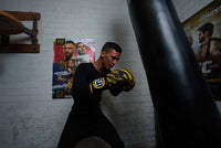 variant:black::TITLE Boxing Thermal Wear Pants guy boxing bag