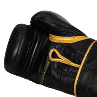 variant:black/gold::TITLE Boxing Momentum Pro Bag Gloves single glove palm view closeup