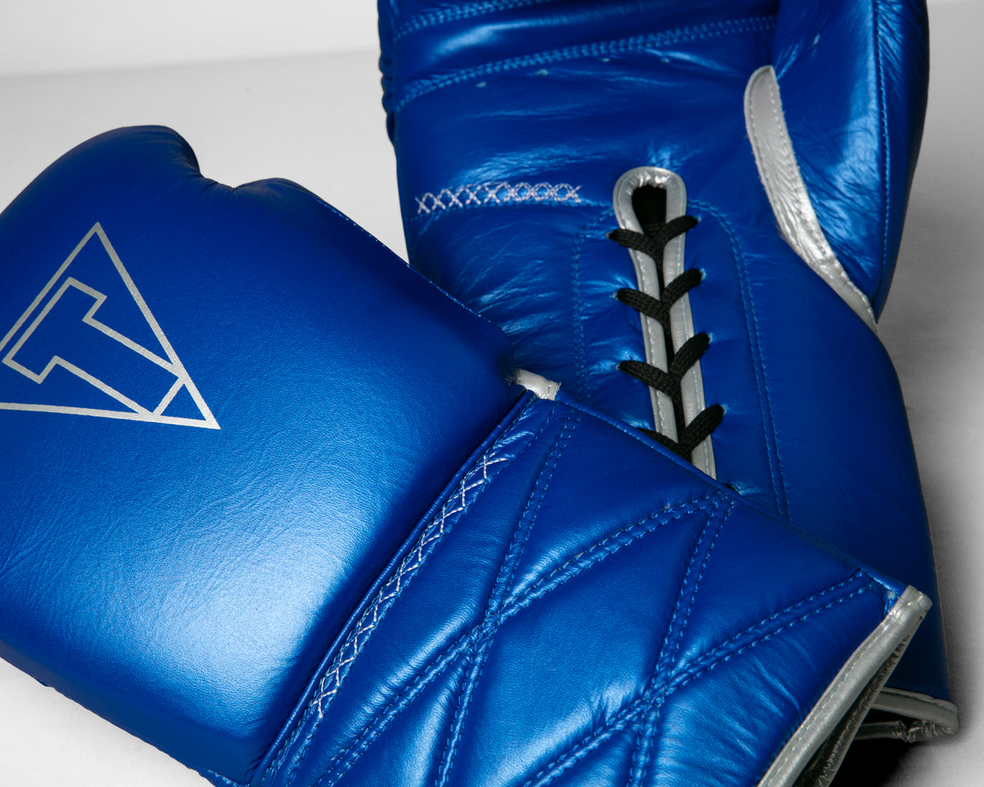 variant:blue/silver::TITLE Boxing Momentum Pro Sparring Gloves closeup of gloves