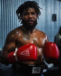variant:red::TITLE Boxing Momentum Pro Sparring Gloves on boxer's hands