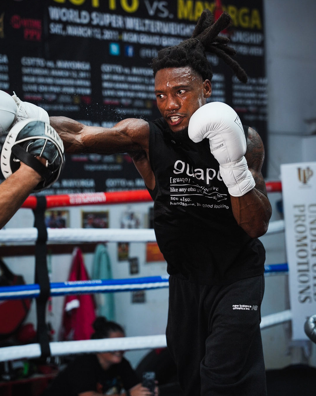 variant:white::TITLE Boxing Momentum Pro Sparring Gloves on boxer training with coach in the ring