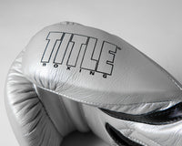 variant:silver/black::TITLE Boxing Momentum Pro Training Gloves closeup of logo on thumb