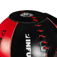 variant:lifestyle::TITLE Boxing Made in the USA Deluxe King Cobra Reflex Bag closeup of stitching on ball