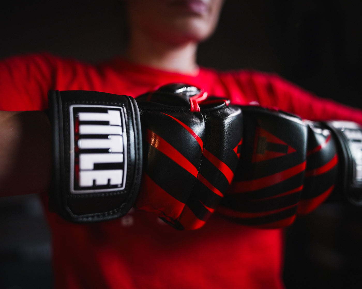 variant:red/black::TITLE MMA Contender Training Gloves red/black on fighter's hands
