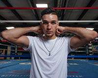 variant:lifestyle::TITLE Boxing Gloves Necklace guy putting on necklace