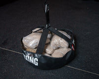 variant:lifestyle::TITLE Boxing Open-Face Bag Anchor showing use of sand bags to anchor a bag