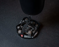 variant:lifestyle::TITLE Boxing Open-Face Bag Anchor view showing various weights in the anchor