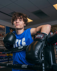 variant:black::TITLE Boxing Old School Leather Bag Gloves 2.0 kid on ring