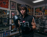 variant:black::TITLE Boxing Old School Leather Bag Gloves 2.0 hood up and gloves on