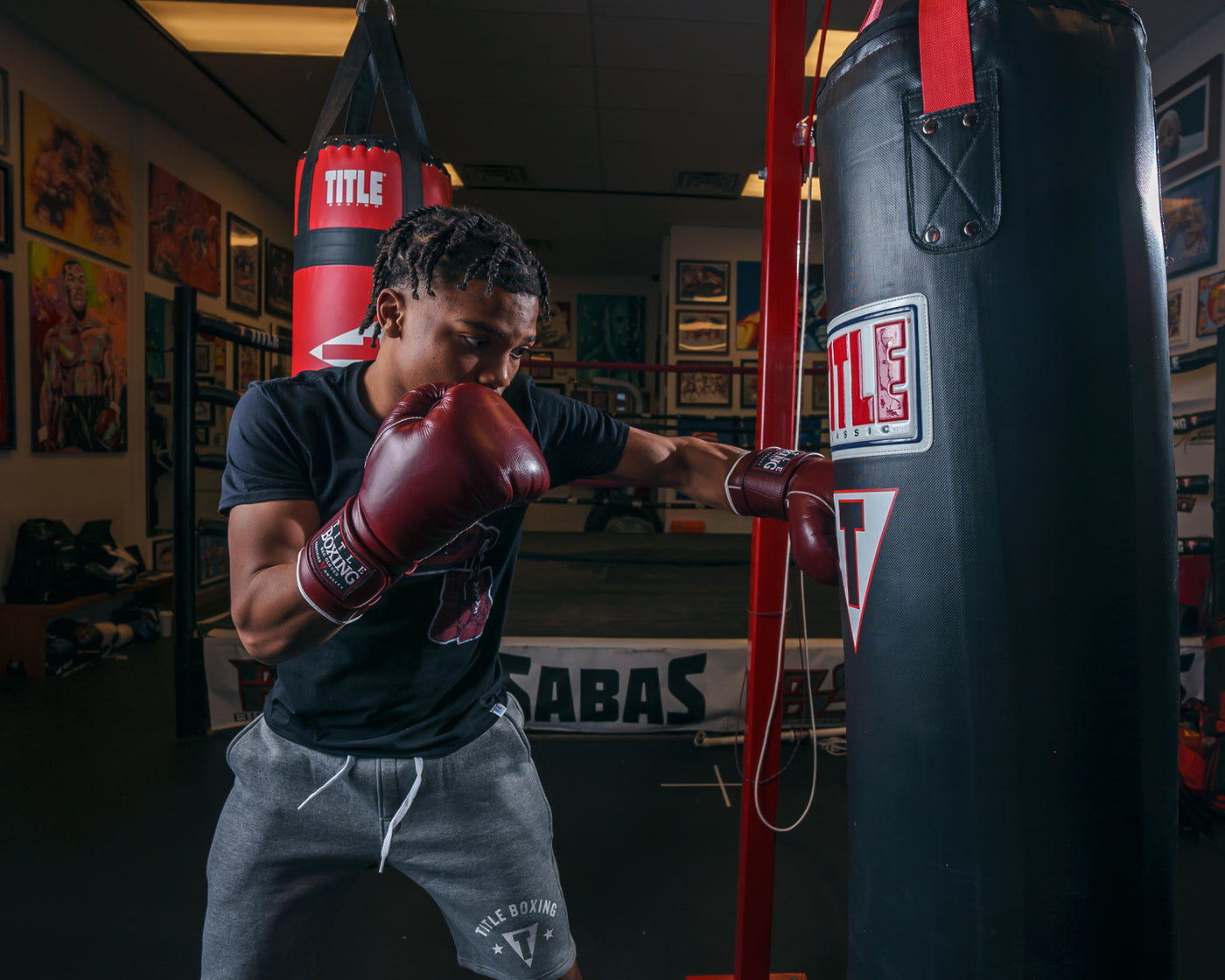 variant:maroon::TITLE Boxing Old School Leather Sparring Gloves 2.0  left hook to bag
