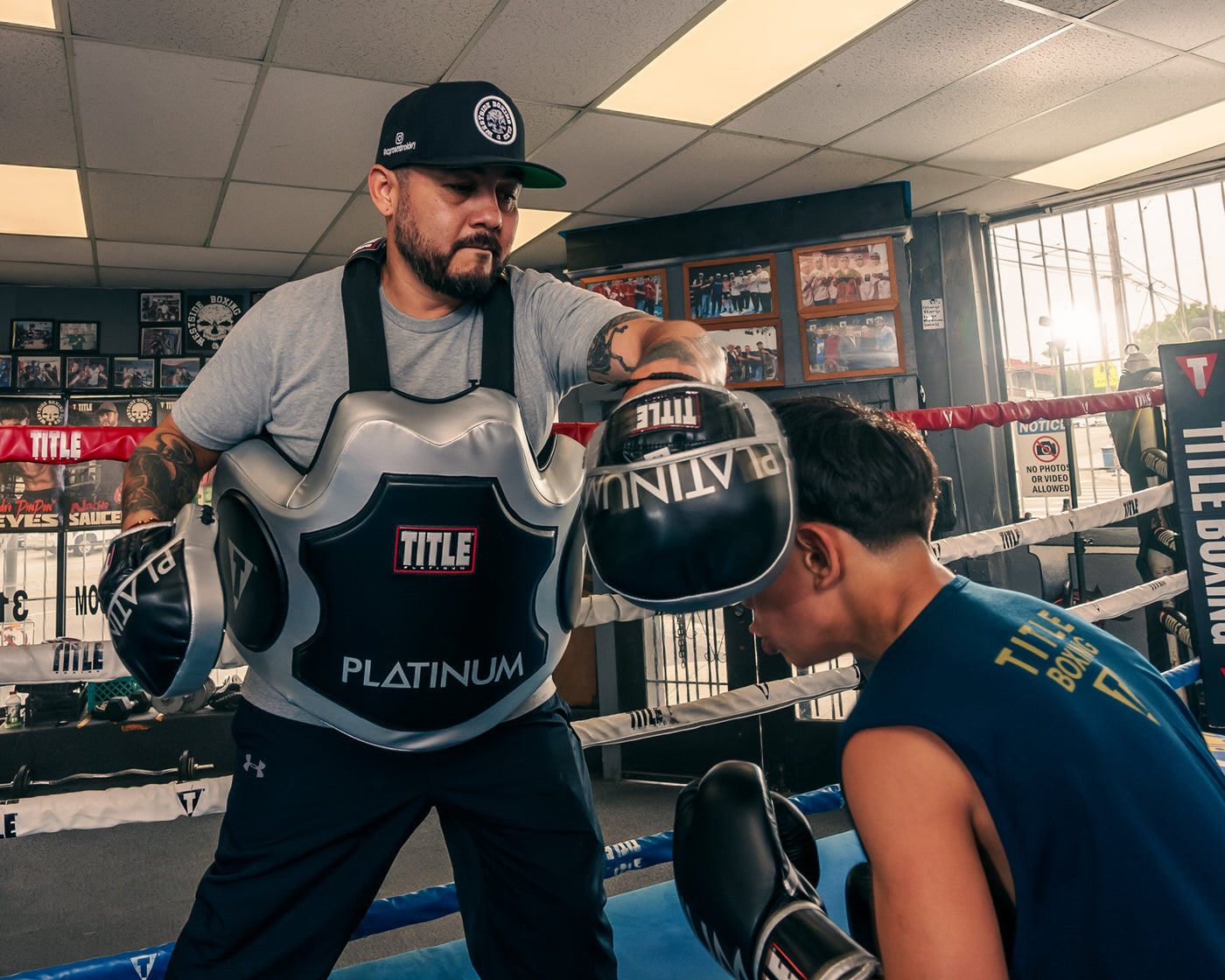 variant:lifestyle::TITLE Platinum Body Protector coach working with fighter