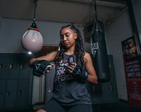 variant:lifestyle::TITLE Platinum Prime Gel Fist Wraps 2.0 girl putting on 