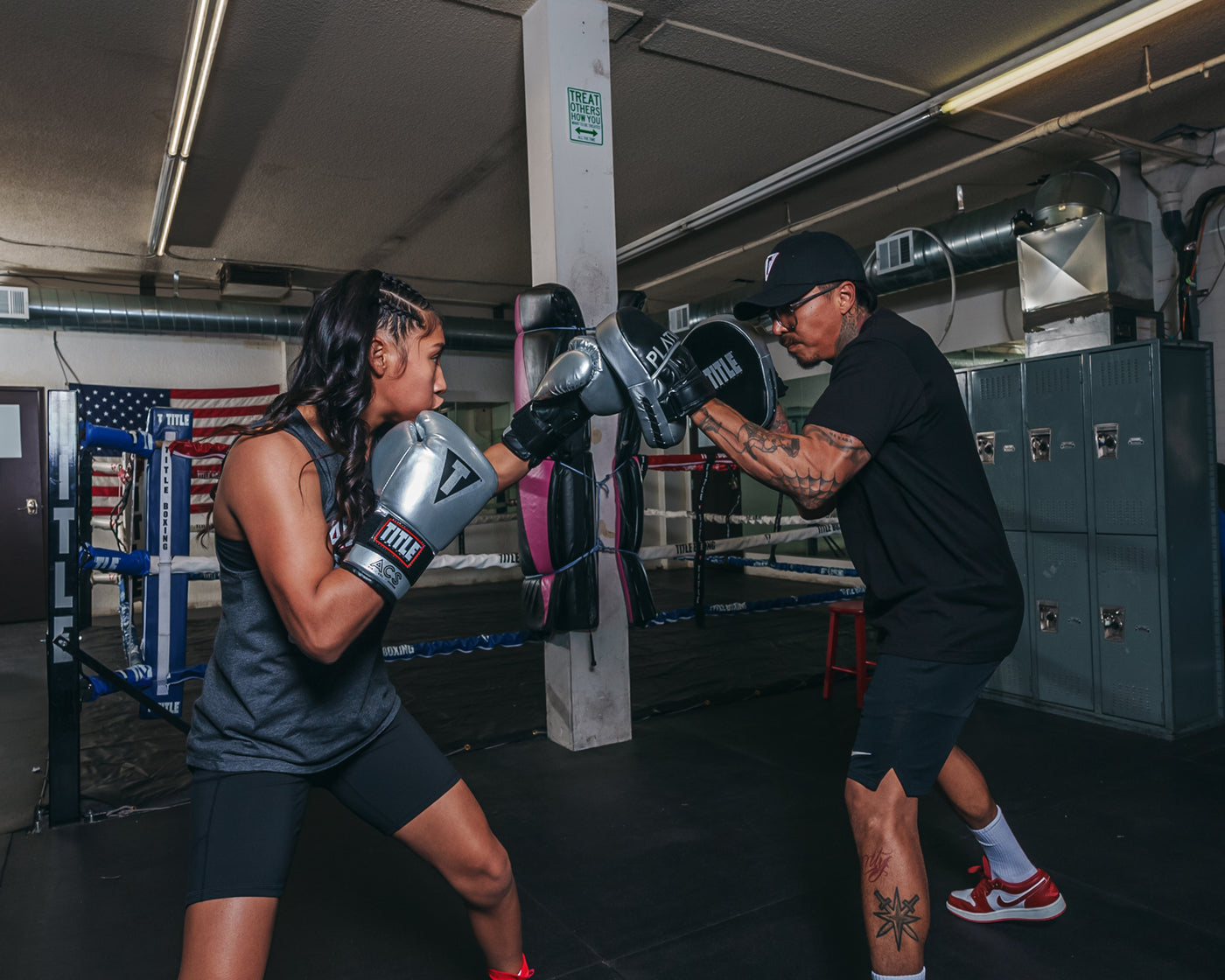 variant:lifestyle::TITLE Platinum Prolific Punch Mitts girl coach mitts