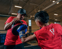 variant:lifestyle::Pro Mex Accuarcy Pro Punch Shield 2.0 kid with coach 