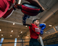 variant:lifestyle::Pro Mex Accuarcy Pro Punch Shield 2.0 kid right jab with coach