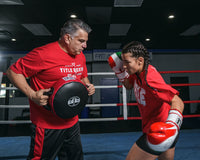 variant:lifestyle::Pro Mex Accuracy Leather Pro Punch Shield 2.0 girl left hook