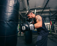variant:Black::Pro Mex Professional Bag Gloves V3.0 guy hitting heavy bag