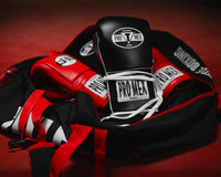 variant:black::Pro Mex Professional Edge Lace Training/Sparring Boxing Gloves in gym bag