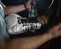 variant:silver::Pro Mex Professional Edge Lace Training/Sparring Boxing Gloves being laced up