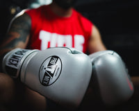 variant:Silver::Pro Mex Professional Edge Training Gloves on the hands of a boxer