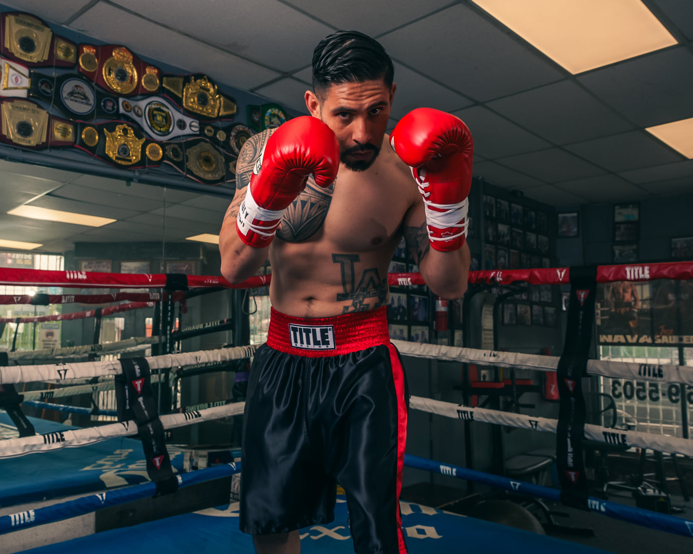 variant:Red/White::Pro Mex Combatiente Pro Fight Gloves boxer hands up in ring