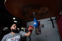 variant:4" x 7"::Pro Mex Professional Speed Bag V2.0 guy hitting bag front facing