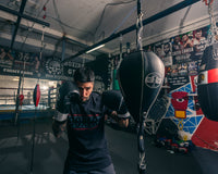 variant:7" x 11"::Pro Mex Professional Double End Bag V2.0 guy getting ready to punch the bag