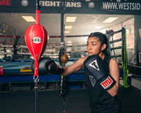 variant:5" x 9"::Pro Mex Professional Double End Bag V2.0 girl hitting the bag with the right hand