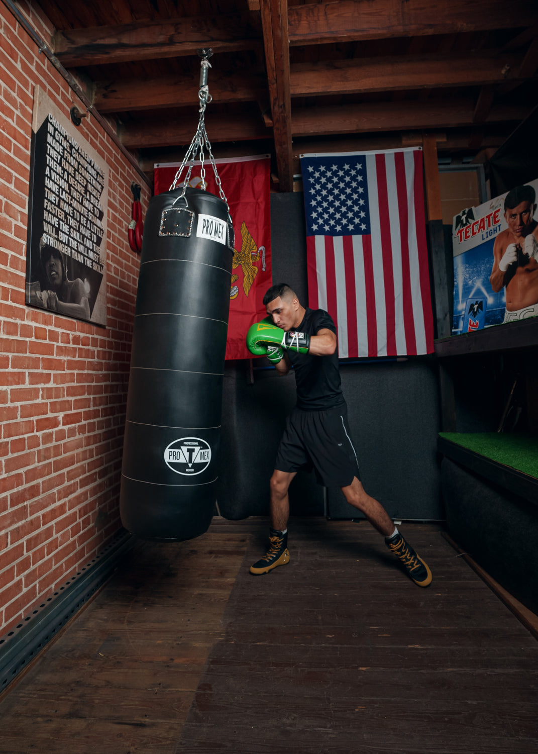 variant:lifestyle::Pro Mex Power Heavy Bag guy hitting bag