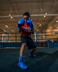 variant:blue::Pro Mex Professional Training Gloves 3.0 kid boxing stance right foot foward