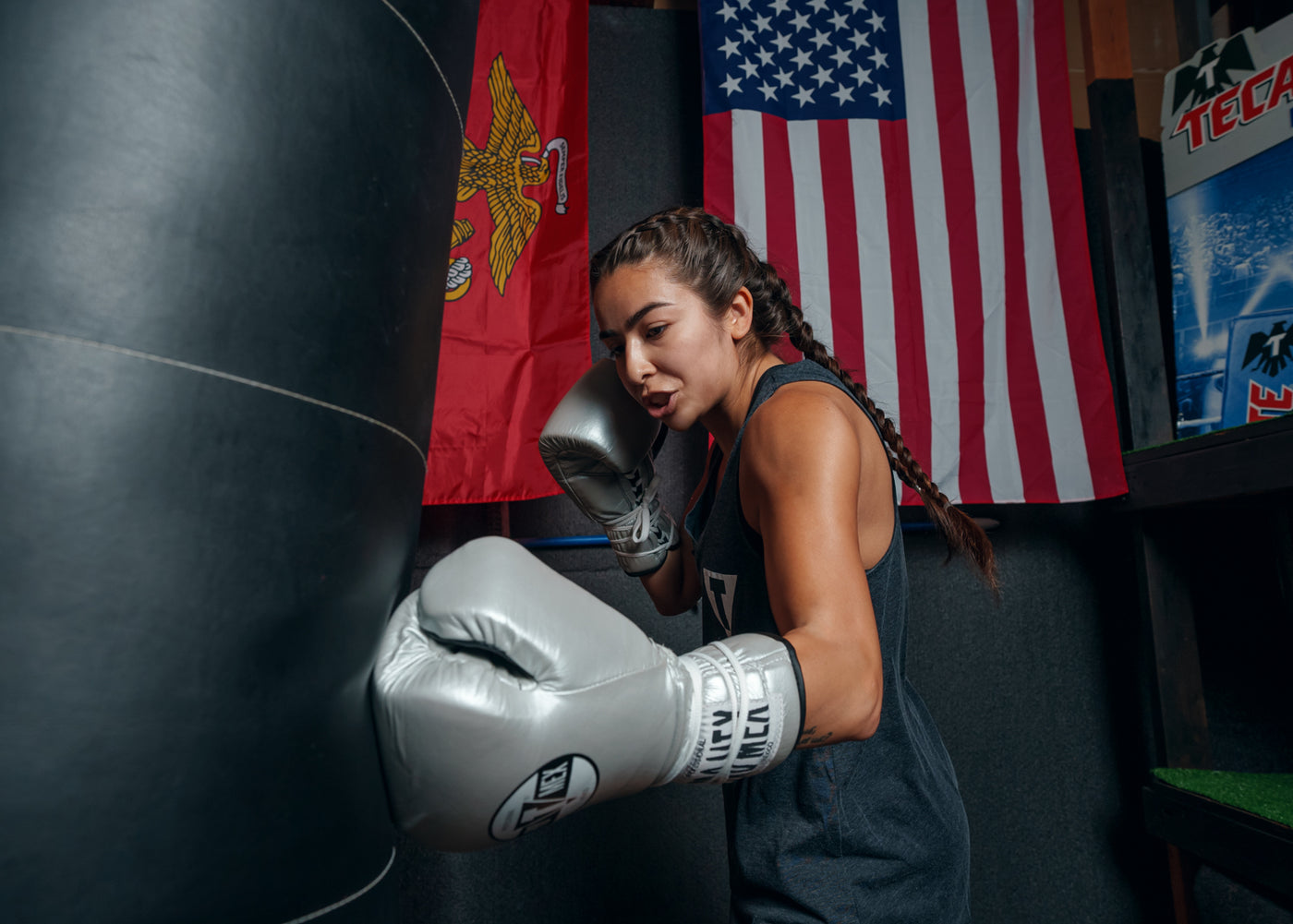 variant:silver::Pro Mex Professional Lace Sparring Gloves V3.0 girl hitting bag left jab