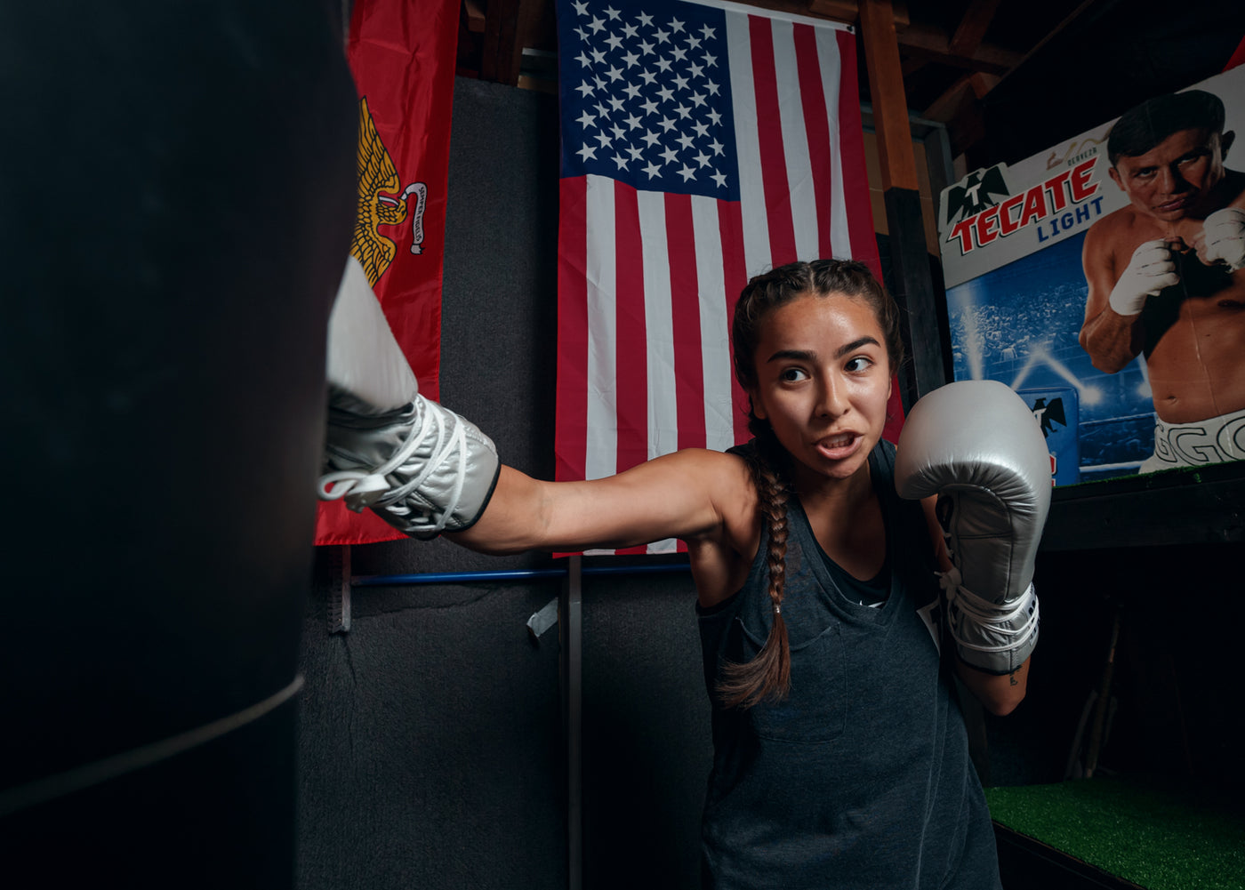 variant:silver::Pro Mex Professional Lace Sparring Gloves V3.0 girl hitting bag right jab