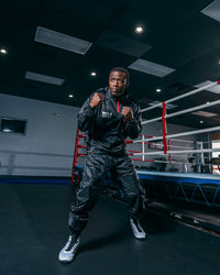 variant:lifestyle::TITLE Platinum Prevail Rubberized Sauna Suit boxing pose