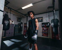 variant:lifestyle::TITLE Platinum Proclaim Boxing Training Gloves boxer standing hands down closer up