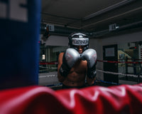 variant:lifestyle::TITLE Platinum Proclaim Boxing Training Gloves boxer standing boxing stance hands up