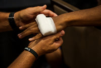 variant:white::TITLE Platinum Primetime Super Gauze Box of 50 rolls gauze on knuckles