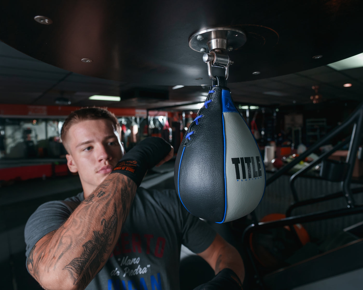 variant:lifestyle::TITLE Platinum Perilous Speed Bag hitting speed bag wearing wraps