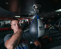 variant:lifestyle::TITLE Platinum Perilous Speed Bag hitting speed bag wearing wraps