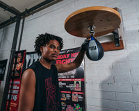 variant:lifestyle::TITLE Platinum Perilous Speed Bag guy holding speed bag