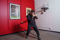 variant:lifestyle::TITLE Boxing Powerquad Resistance System in use by a boxer