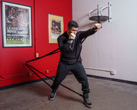 variant:lifestyle::TITLE Boxing Powerquad Resistance System in use in a boxing gym