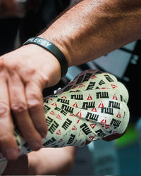 variant:lifestyle::TITLE Boxing Premier Tape closeup of fighter's hand being wrapped