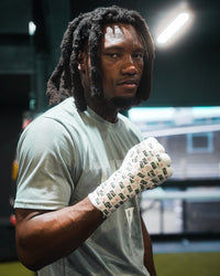variant:lifestyle::TITLE Boxing Premier Tape wrapped on fighter's hand showing fist