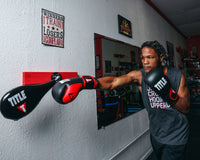 variant:lifestyle::TITLE Boxing Precision Spring-Flex Wall target  boxer right jab