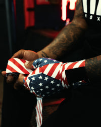 variant:USA flag::TITLE Boxing Print Mexican Style 180" Hand Wraps on boxer's hand