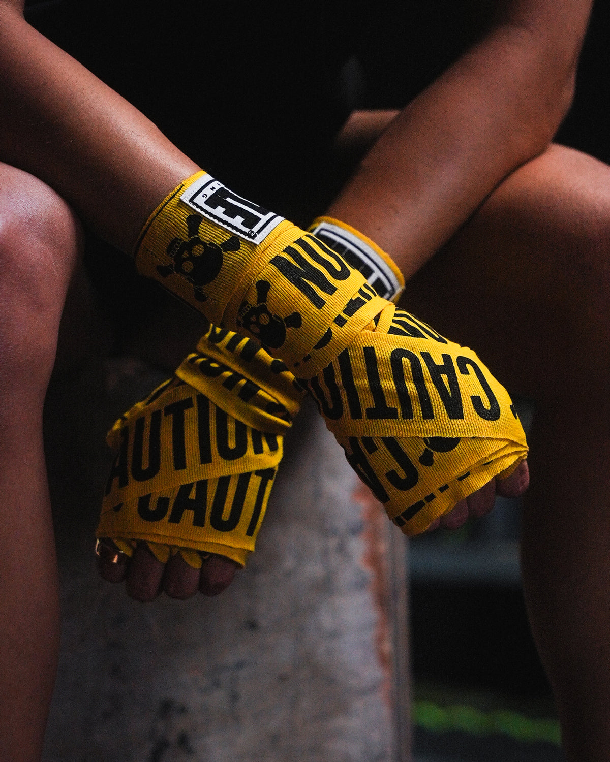 variant:caution::TITLE Boxing Print Mexican Style 180" Hand Wraps closeup on boxer's hands