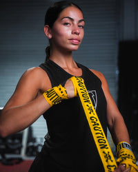 variant:caution::TITLE Boxing Print Mexican Style 180" Hand Wraps being rolled onto fighter's hands