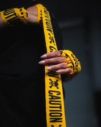 variant:caution::TITLE Boxing Print Mexican Style 180" Hand Wraps being rolled onto fighter's hands closeup